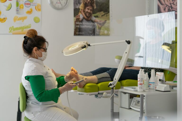 Podiatry clinic procedure in progress, background image for the Overcoming Onychomycosis review
